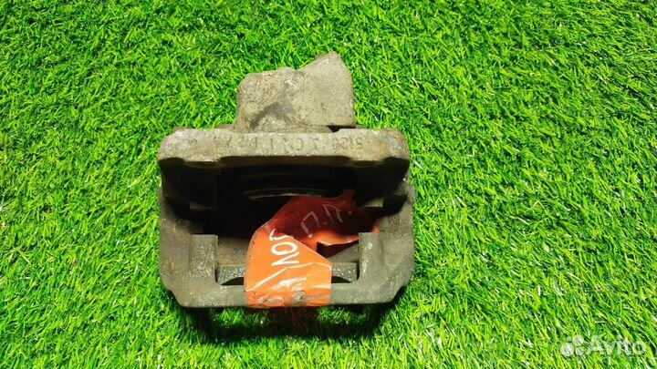 Тормозной суппорт правый передний Renault Logan