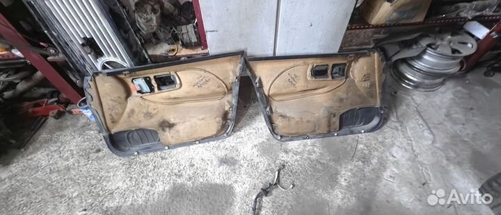 Обшивка карта двери на Субару Импреза 96г