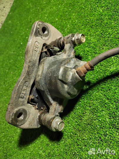 Суппорт тормозной передний левый Kia Spectra 1 S6D