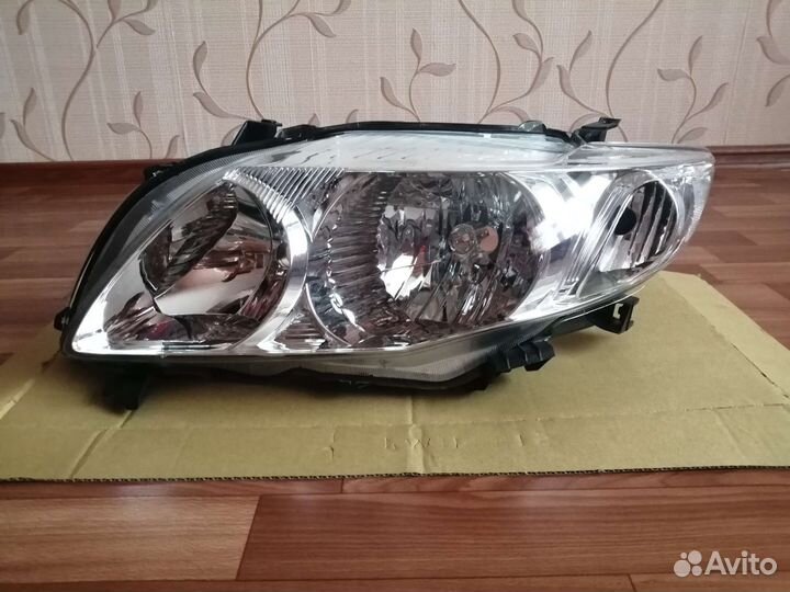 Фара левая Toyota Corolla 150