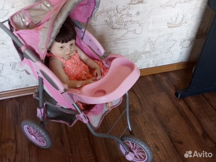 Кукла-реборн в коляске