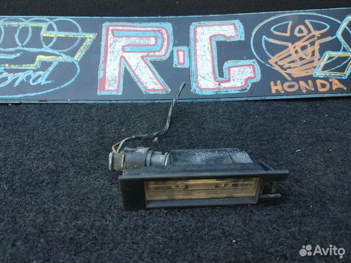 Фонарь подсветки номера Opel Astra H хэтчбек 1.6