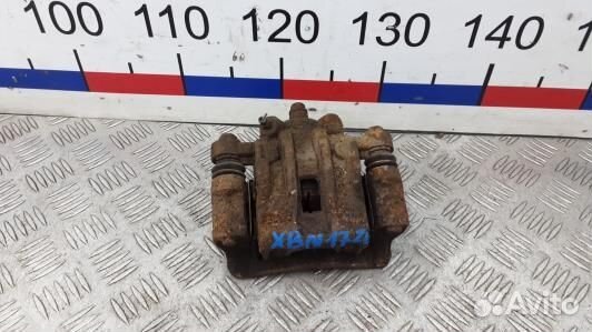 Суппорт тормозной задний левый KIA RIO 2 (XBN17LS0