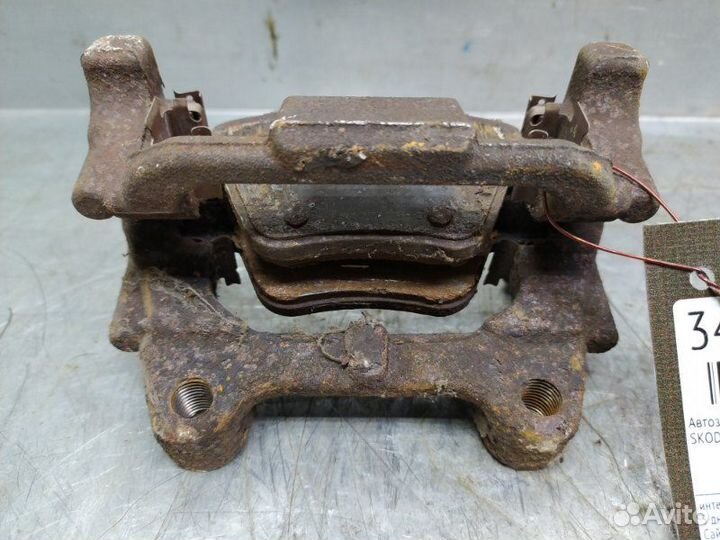 Скоба суппорта заднего правого Skoda Octavia (A5
