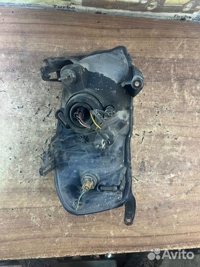 Фара левая оригинал Мазда Трибьют