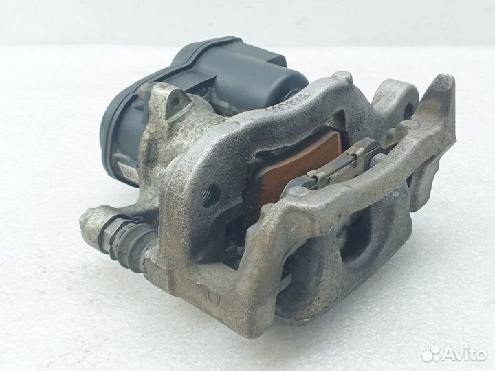 Суппорт тормозной задний левый Nissan Qashqai J11