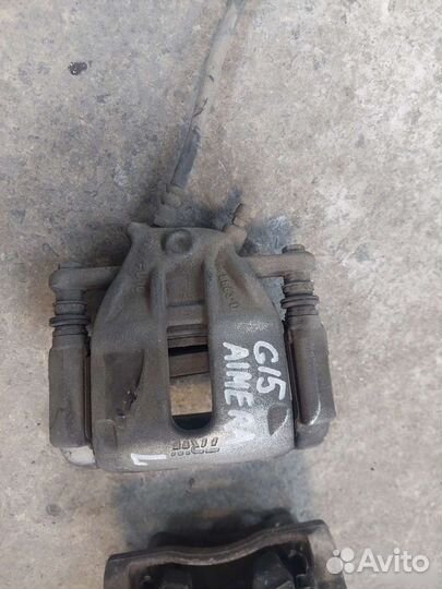 Суппорт левый правый Nissan Almera G15