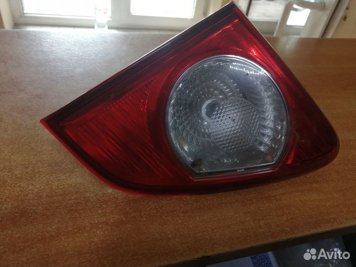 Фонарь правый в крышку багажника Corolla E150