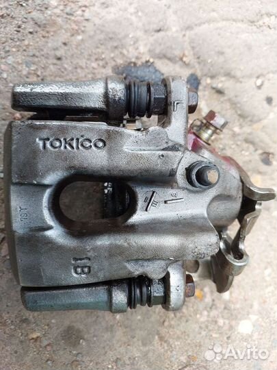 Суппорт задний левый Toyota corolla E 150