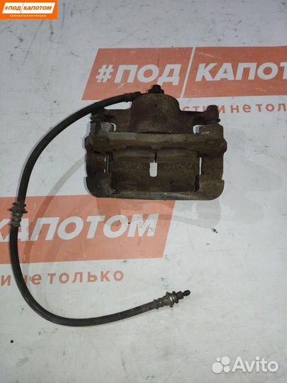 Суппорт тормозной передний левый Nissan X-Trail