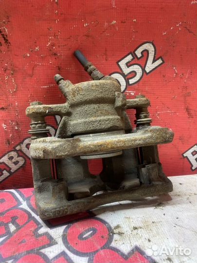 Суппорт тормозной передний левый Nissan Almera G15