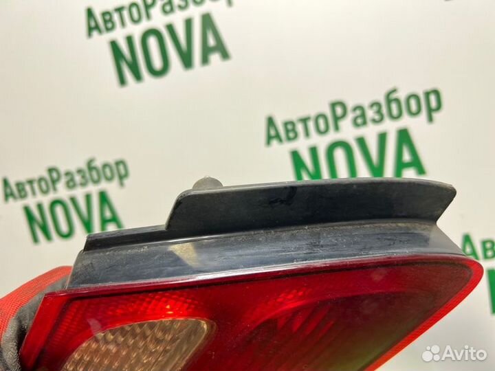 Фонарь заднего хода задний левый Nissan Almera N16