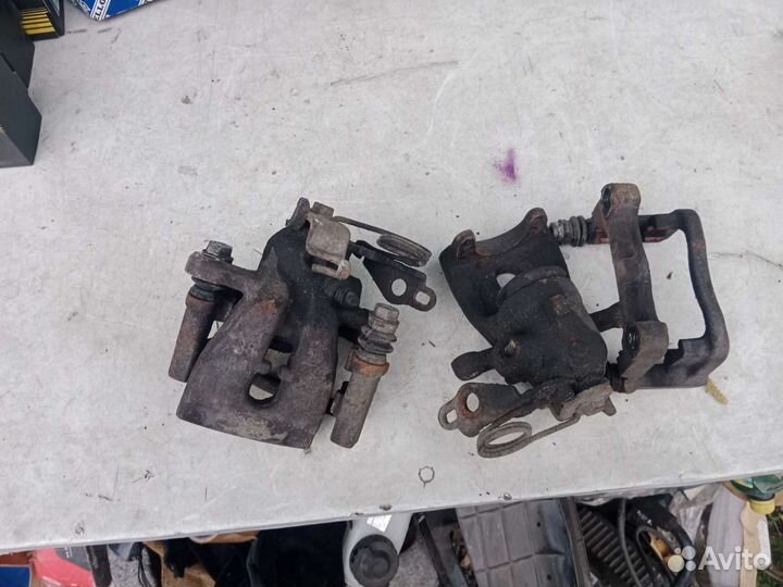 Суппорт тормозной задний левый Ford Mondeo 4