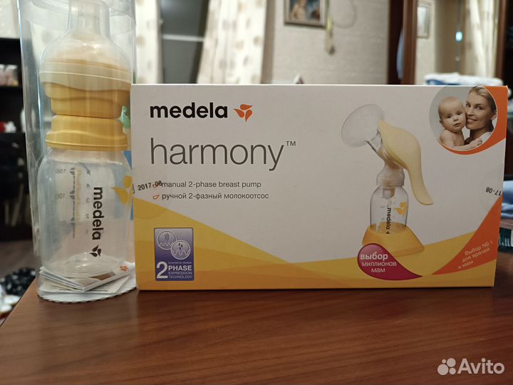 Молокоотсос ручной и бутылочка с соской medela