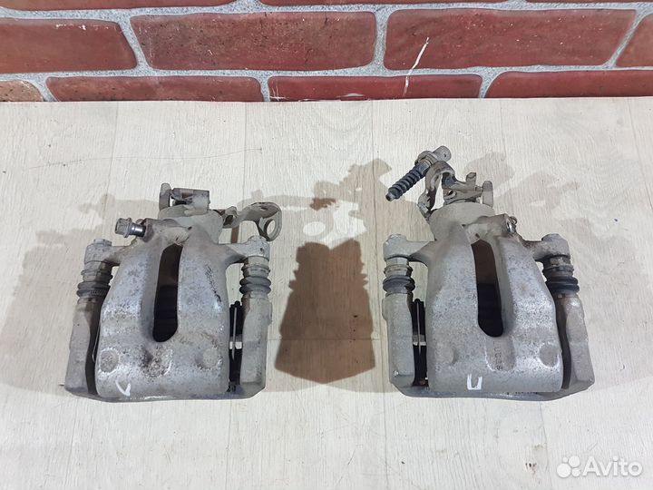 Суппорт задний левый Opel astra h