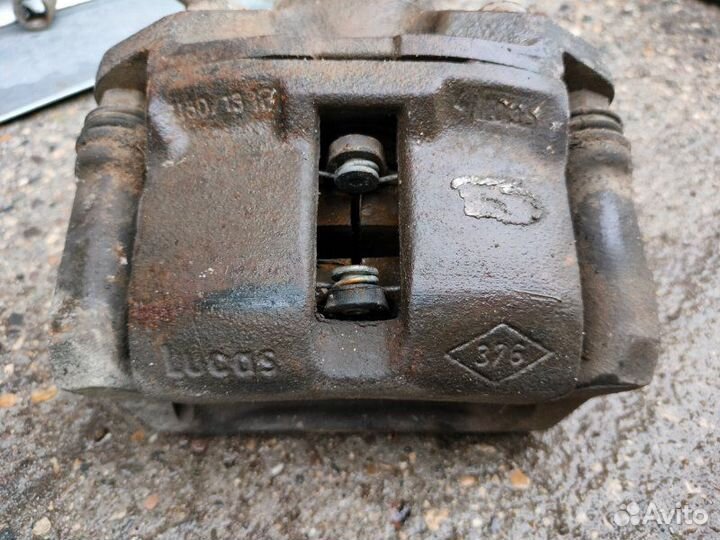 Суппорт тормозной передний Renault Logan седан K7J