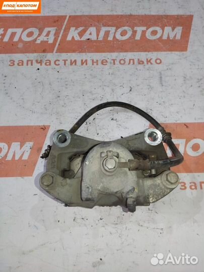 Суппорт тормозной передний левый Nissan Teana J32