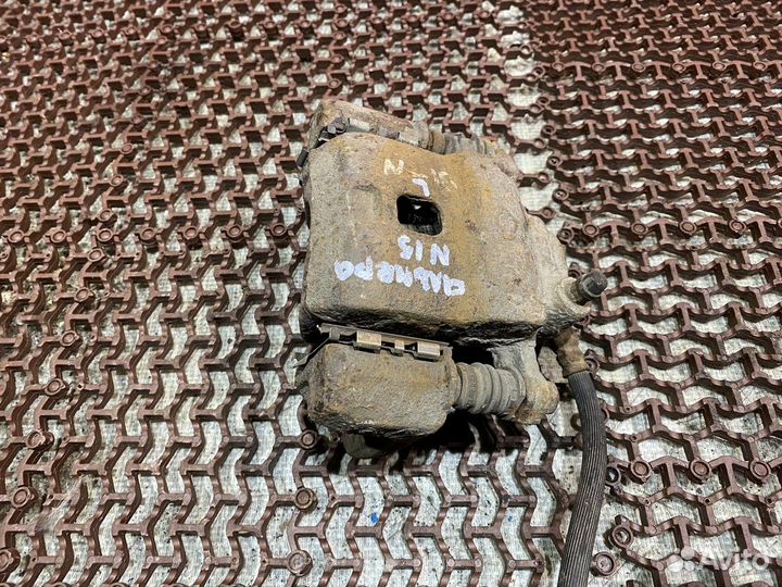 Суппорт передний левый Альмера Н15 Nissan Almera