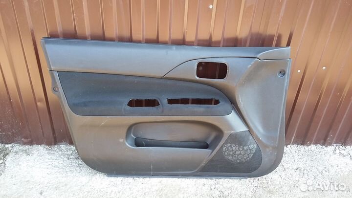 Обшивка двери Mitsubishi Lancer 9