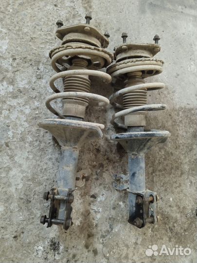 Стойки передние Мазда 626 GD