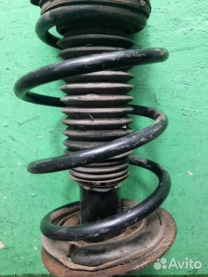 Стойка амортизатора передняя левая KIA Sportage 3