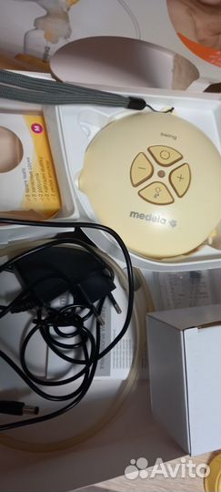 Эл. молокоотсос Medela swing с бутылками, сосками