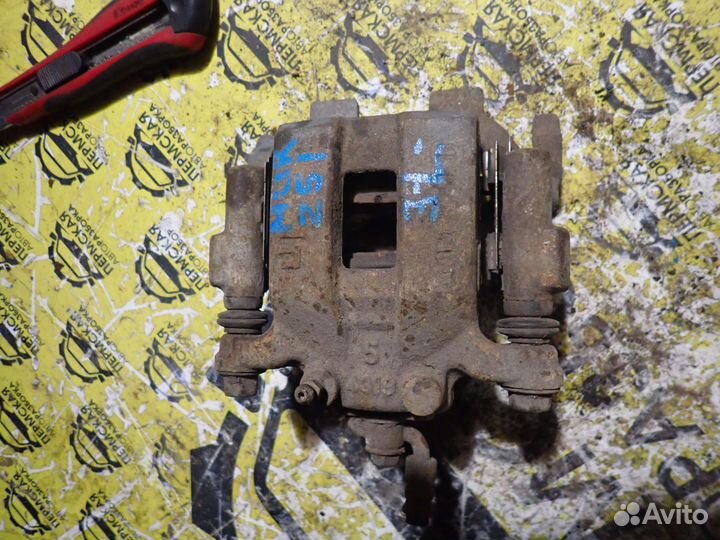 Суппорт тормозной задний левый Nissan Murano Z51