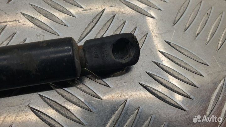 Амортизатор двери багажника задний левый Mazda