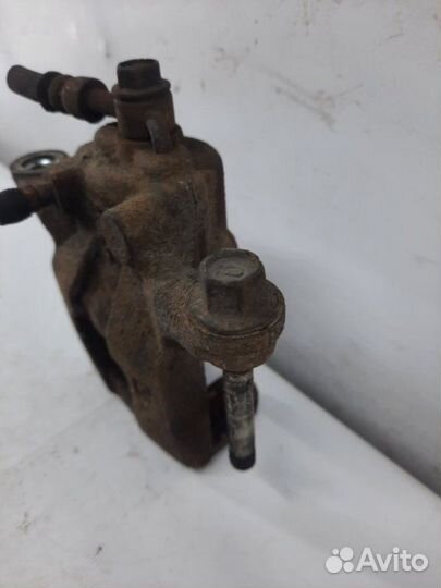 Суппорт тормозной задний левый Nissan Qashqai