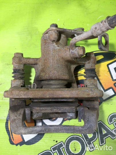 Суппорт тормозной задний левый Kia Rio 3