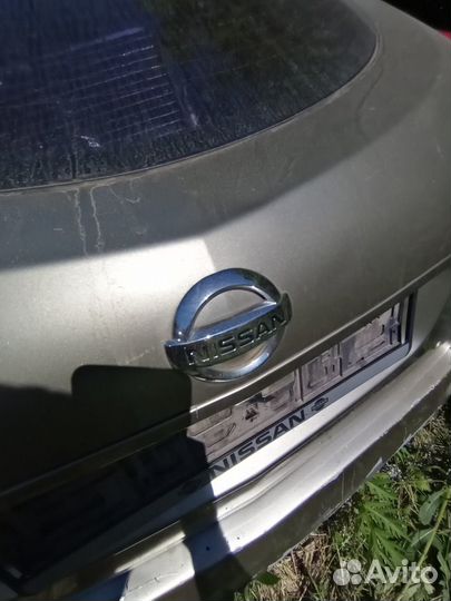 Задняя эмблема Nissan Primera Р12