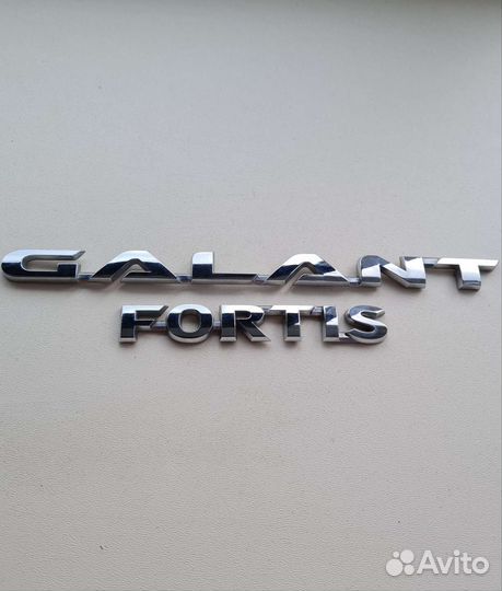 Рамка номерного знака, Шильдик Lancer 10