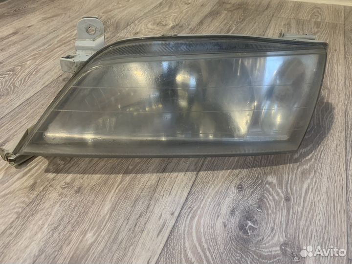Фара левая toyota carina 210