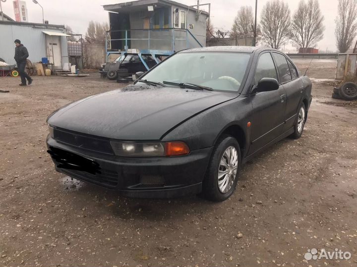 Суппорт передний левый Mitsubishi Galant 8