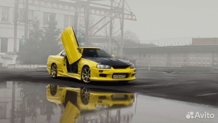 Передний бампер C-West на Nissan Skyline R34