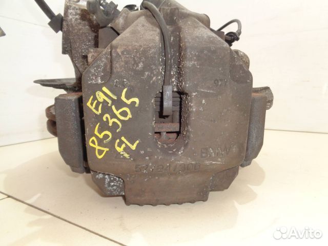 Суппорт BMW E91 перед лево