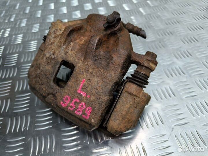 Суппорт тормозной передний левый Hyundai Tucson