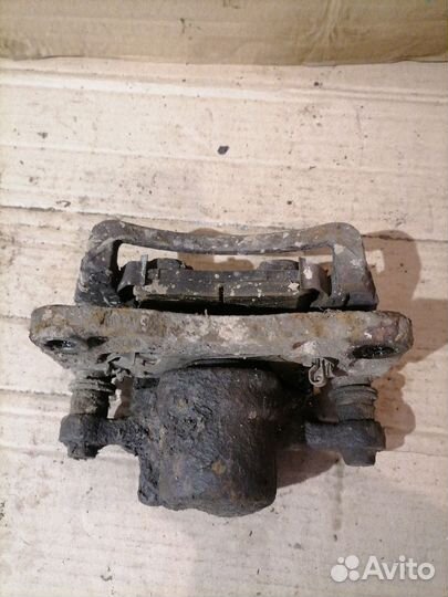 Суппорт тормозной задний левый Opel Antara