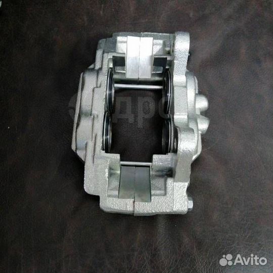 Суппорт тормозной перед R/L Land Cruiser Prado