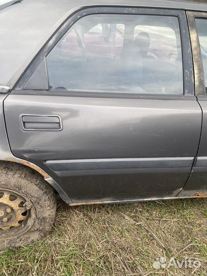 Задняя правая дверь mazda 323f bg