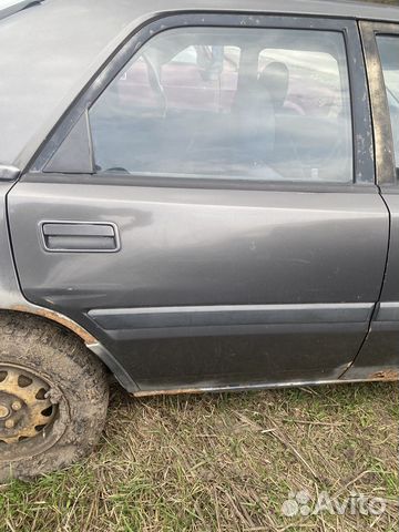 Задняя правая дверь mazda 323f bg