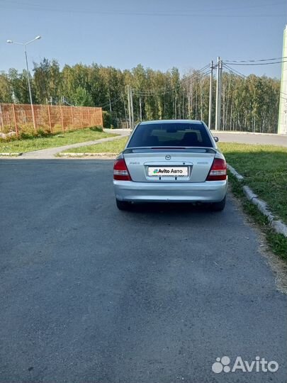 Mazda Familia 1.3 AT, 1999, 100 000 км
