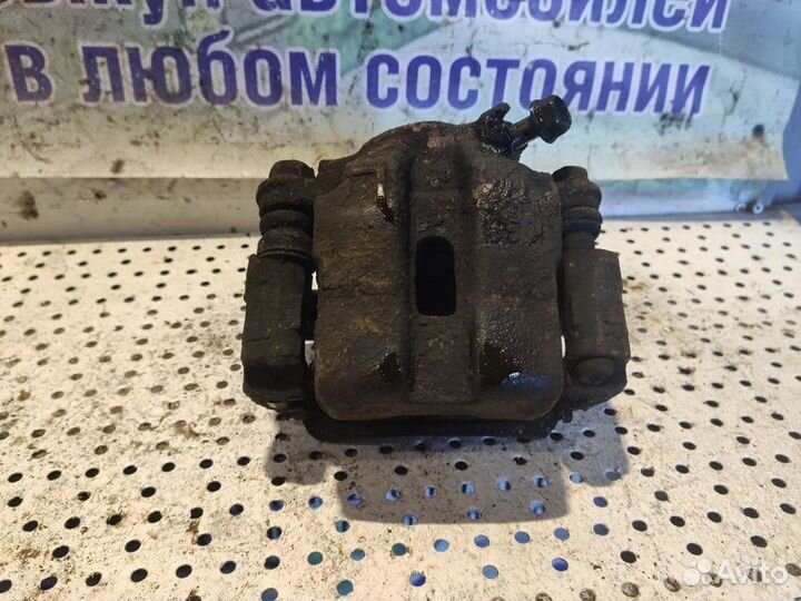 Суппорт тормозной передний левый Suzuki Grand Vita