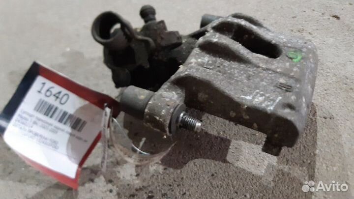 Суппорт тормозной задний левый задний левый Ford