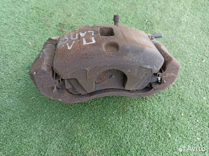 Тормозной суппорт передний левый Mitsubishi Lancer