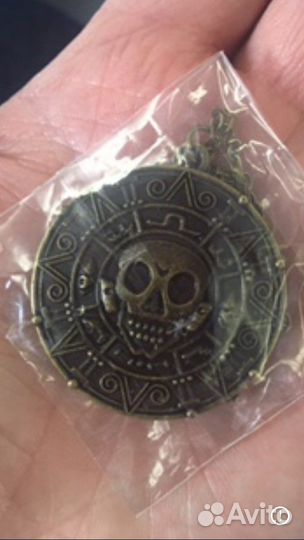 Монета Пираты карибского моря