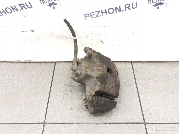 Суппорт тормозной передний левый Mitsubishi Lancer