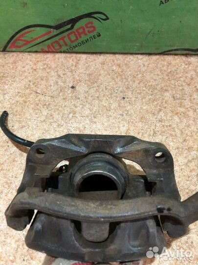 Суппорт тормозной передний левый Renault Scenic 1