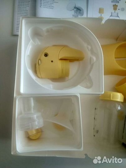 Молокоотсос medela электрический