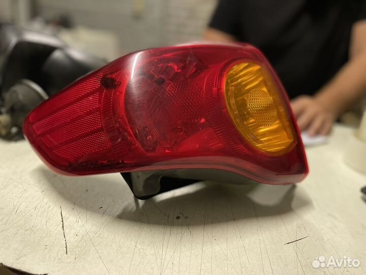 Фонарь задний левый Toyota Corolla E150